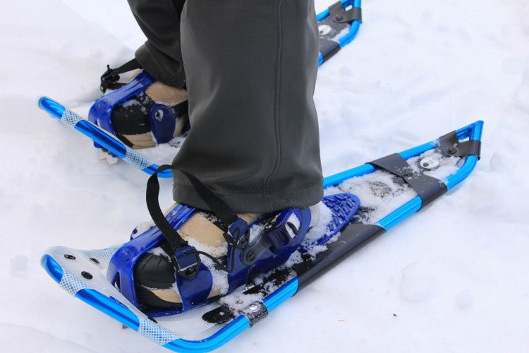 snowshoeing in york, maine using crescent moon snowshoes (blue color)