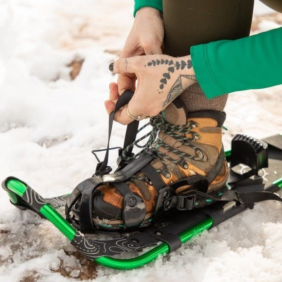 Woman Using Snowshoe Rental Equipment in Maine